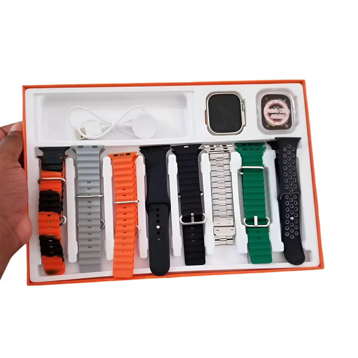 7 in 1 ultra Set of watch straps and accessories in a box held by a hand