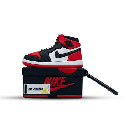 Black, red, and white sneaker  case for airpods pro 2 on a Nike box with a white background