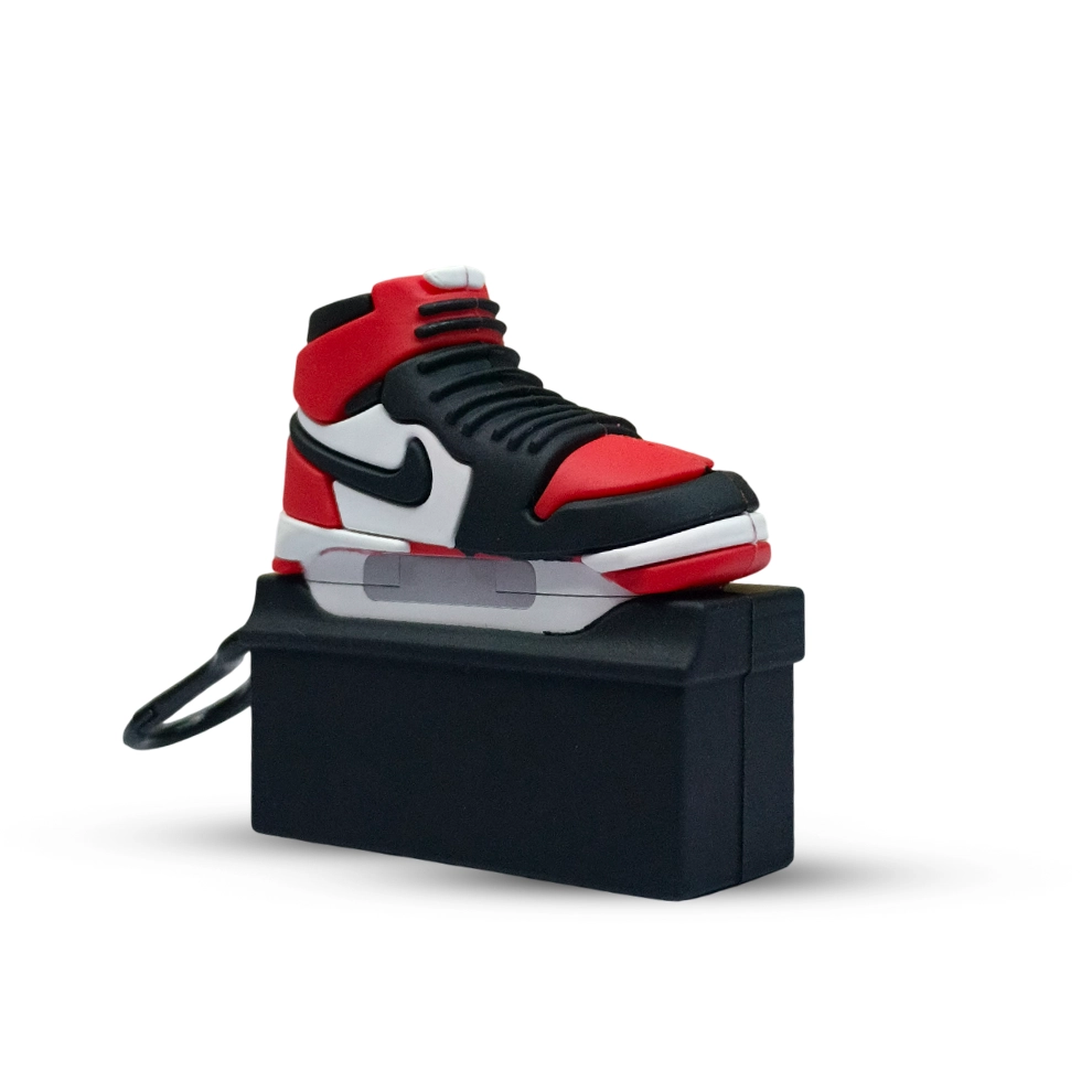 Black, red, and white sneaker case  on a black stand against a white background